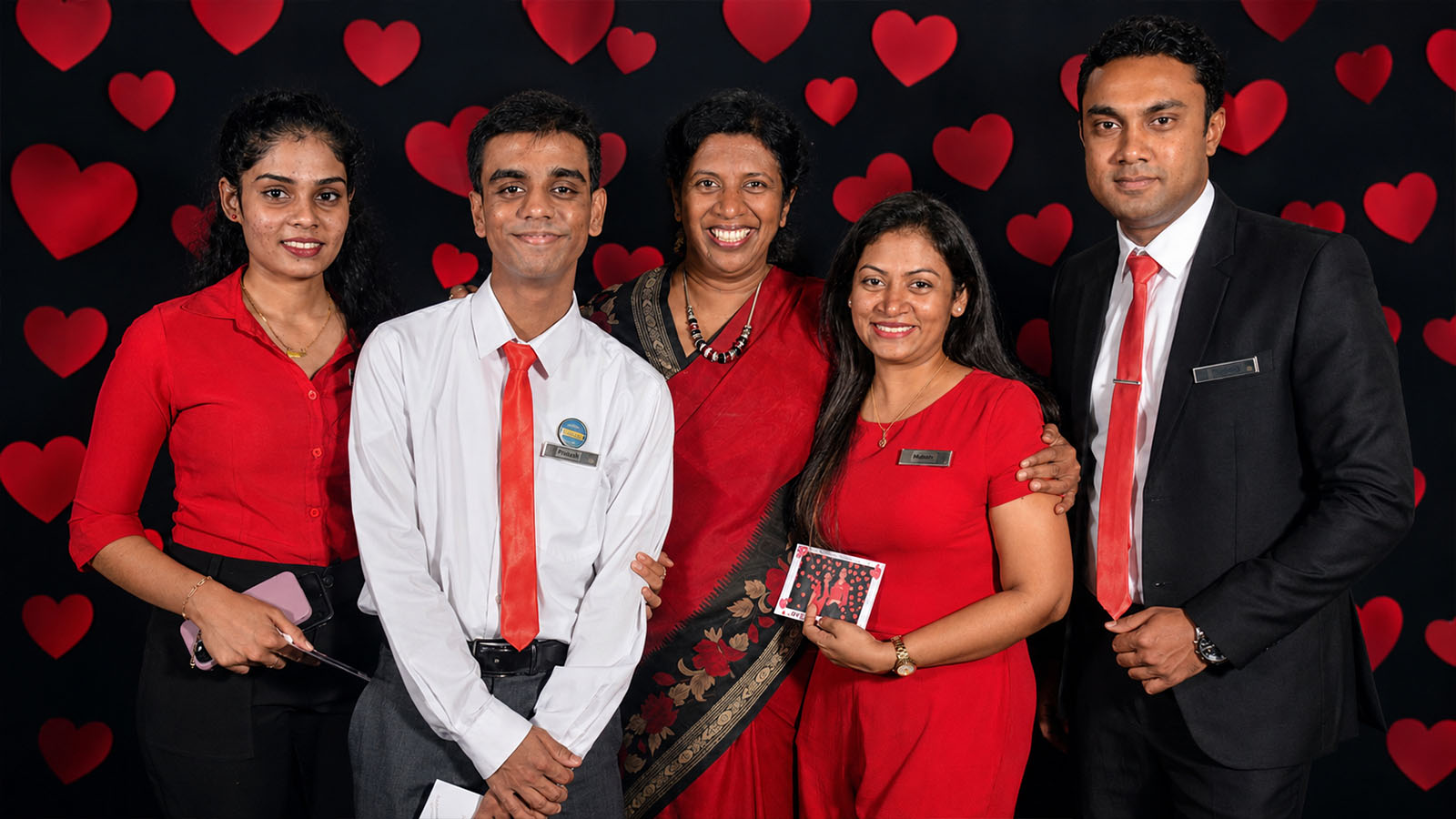 Corporate event guests posing with photobooth props