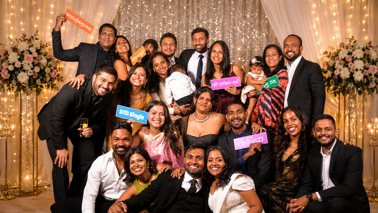 Wedding celebration group photo with props and lights